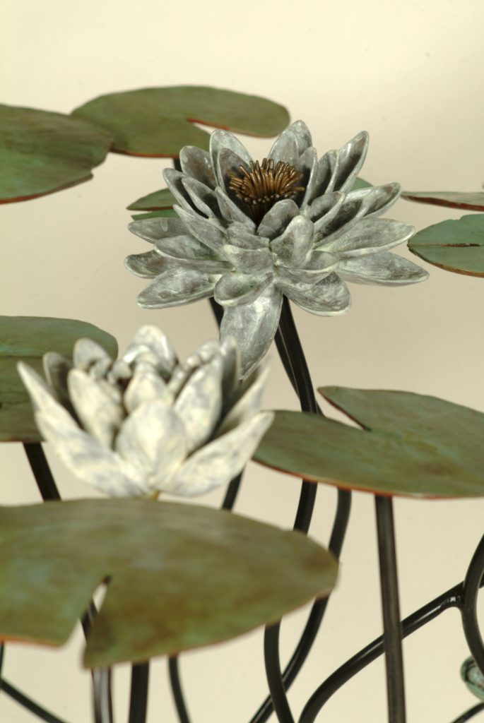 Bronze and steel sculpture of water lilies.