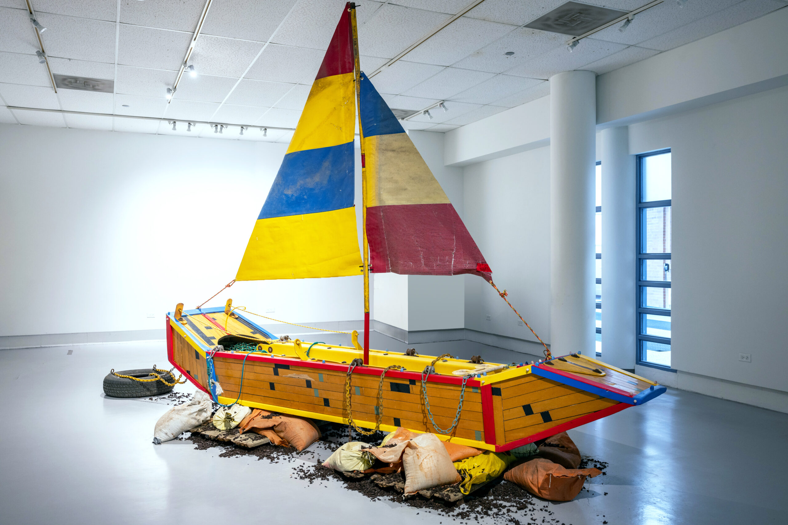 Delicate and Filled with Dynamite. Boat made from basketball court flooring and abandoned playground remnants 15ft long x 13ft tall 2023