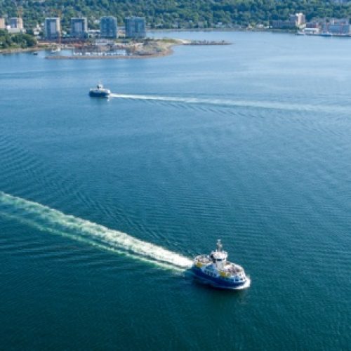 Aerial view of a ferry crossing Halifax Harbour