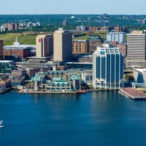 Halifax skyline across the harbour with a ferry crossing